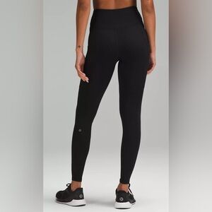 Black Fast and Free High-Rise Thermal Lululemon leggings with pockets in size 2
